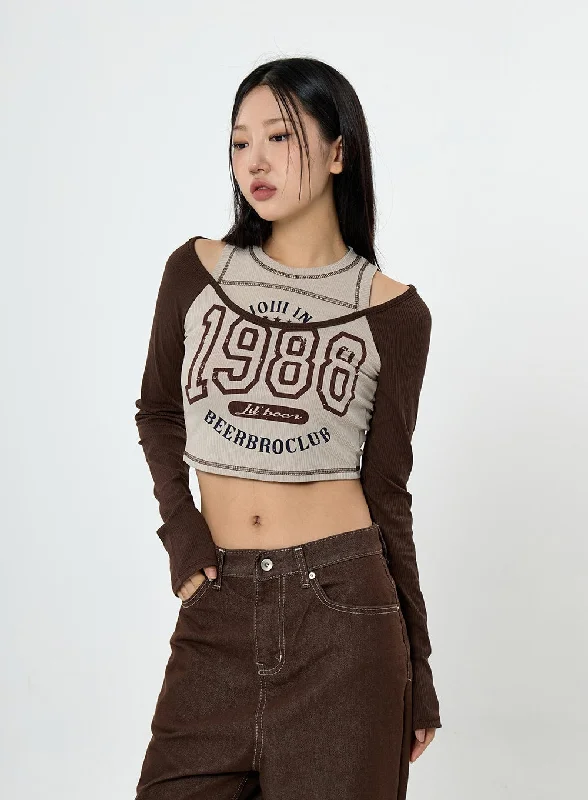 Tie - Front Women's Crop Top in Orange for a Playful and Adjustable FitBenet Lettering Long Sleeve T-Shirt CS23 Tie - Front Women's Crop Top in Orange for a Playful and Adjustable FitBenet Lettering Long Sleeve T-Shirt CS23